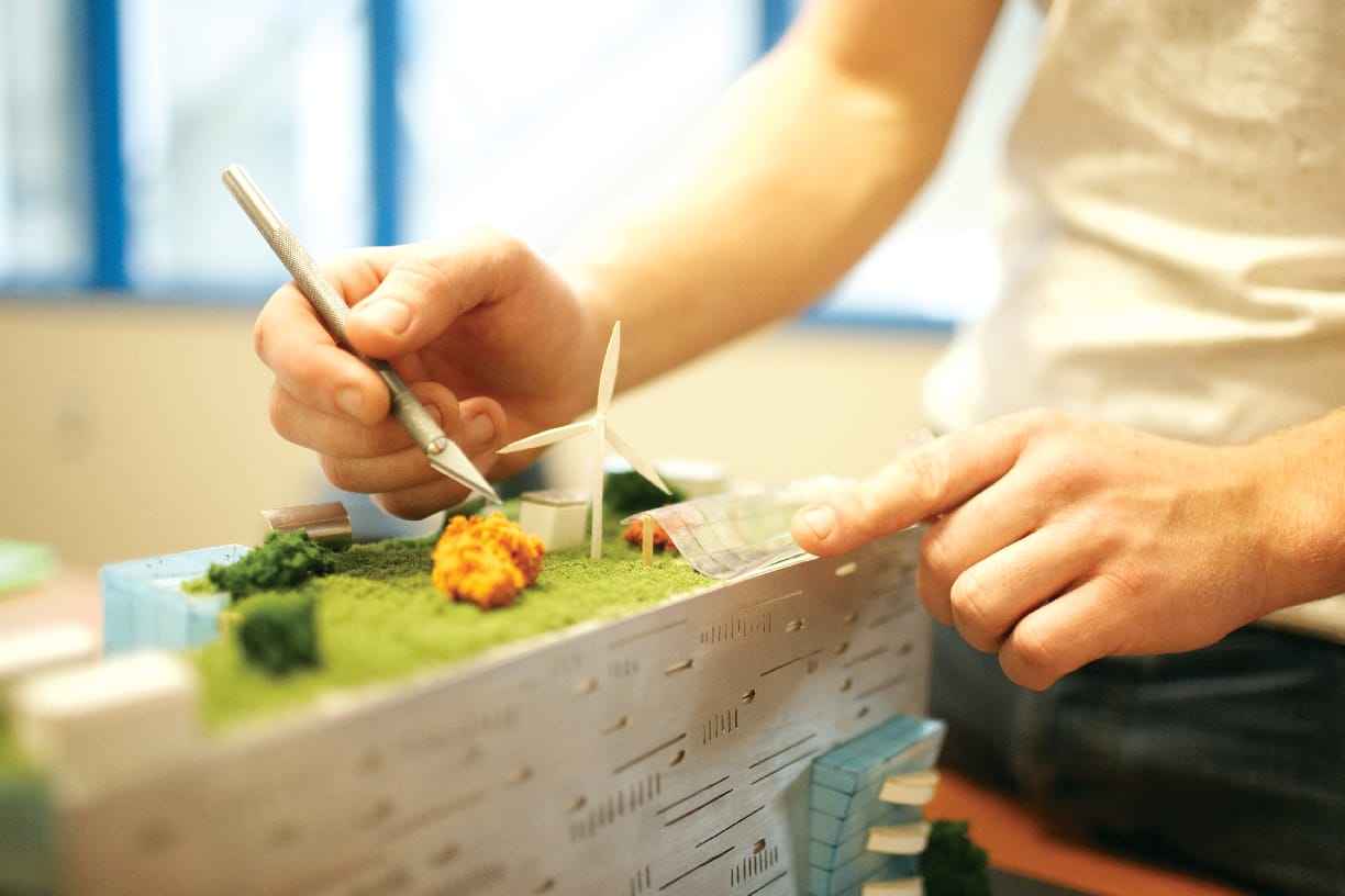 Architecture student working on a model in the lab.