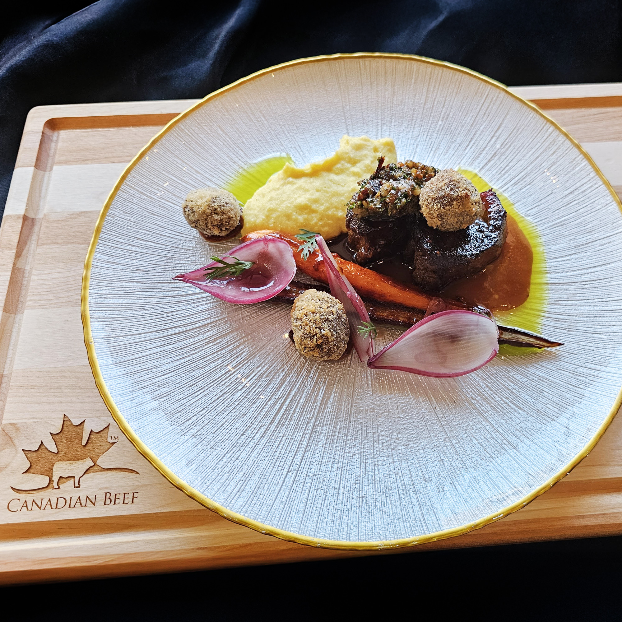 Prize winning dish of Beef Tongue on a gold rimmed glass dish