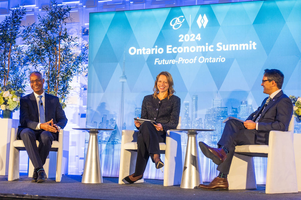 Dr. Gervan Fearon, Barbara Zvan, and Daniel Tisch onstage at the Ontario Economic Summit