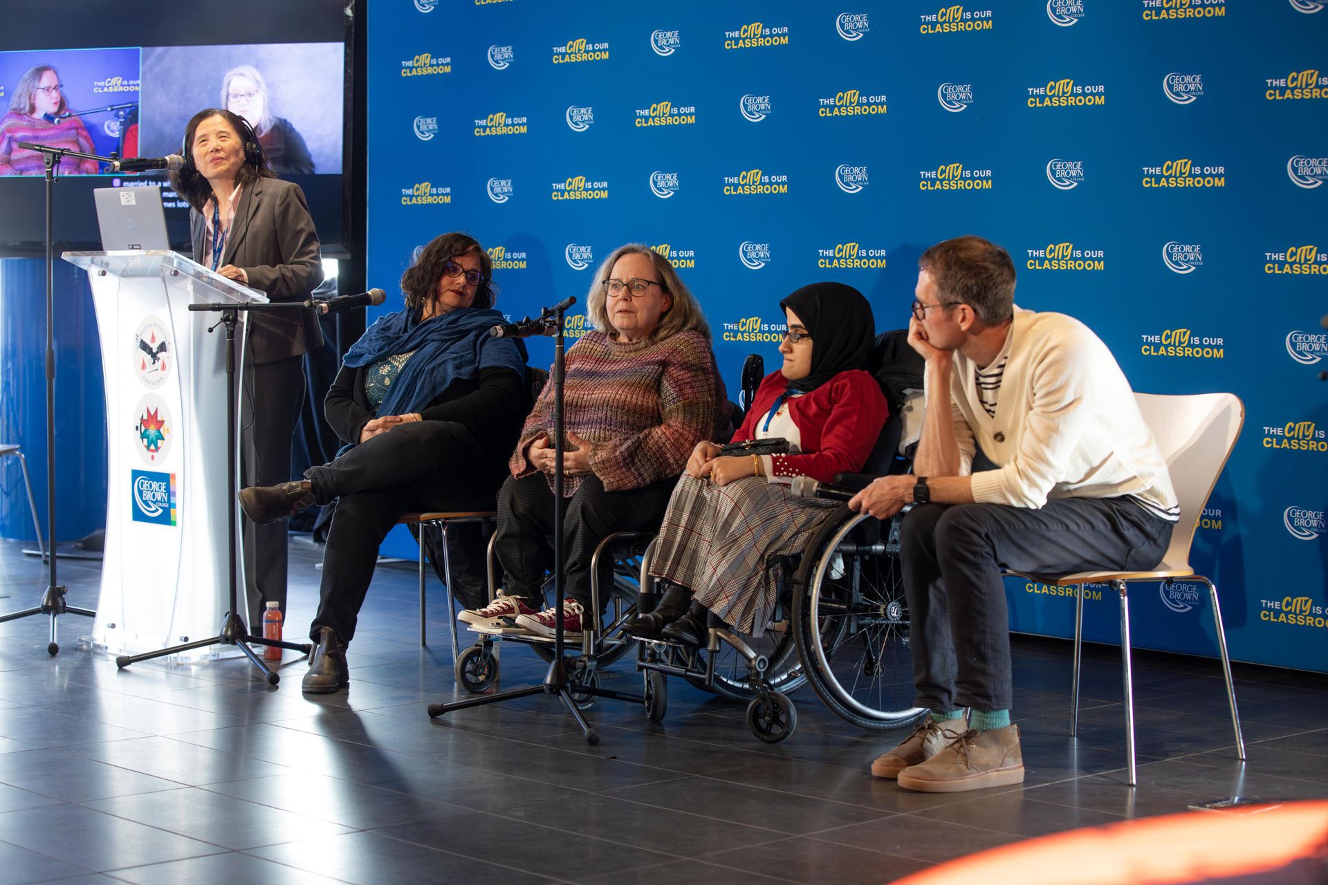 A group of people seated for a panel