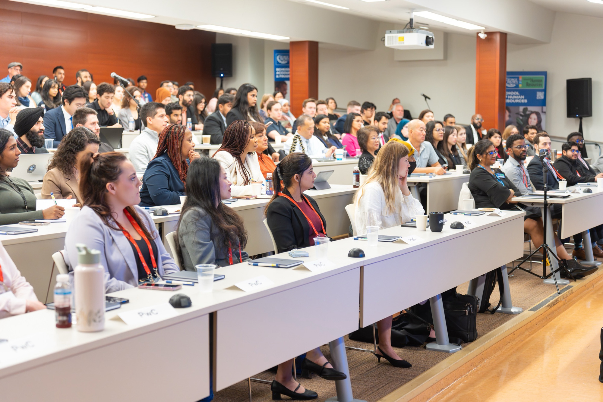 People seated in a lecture theatre