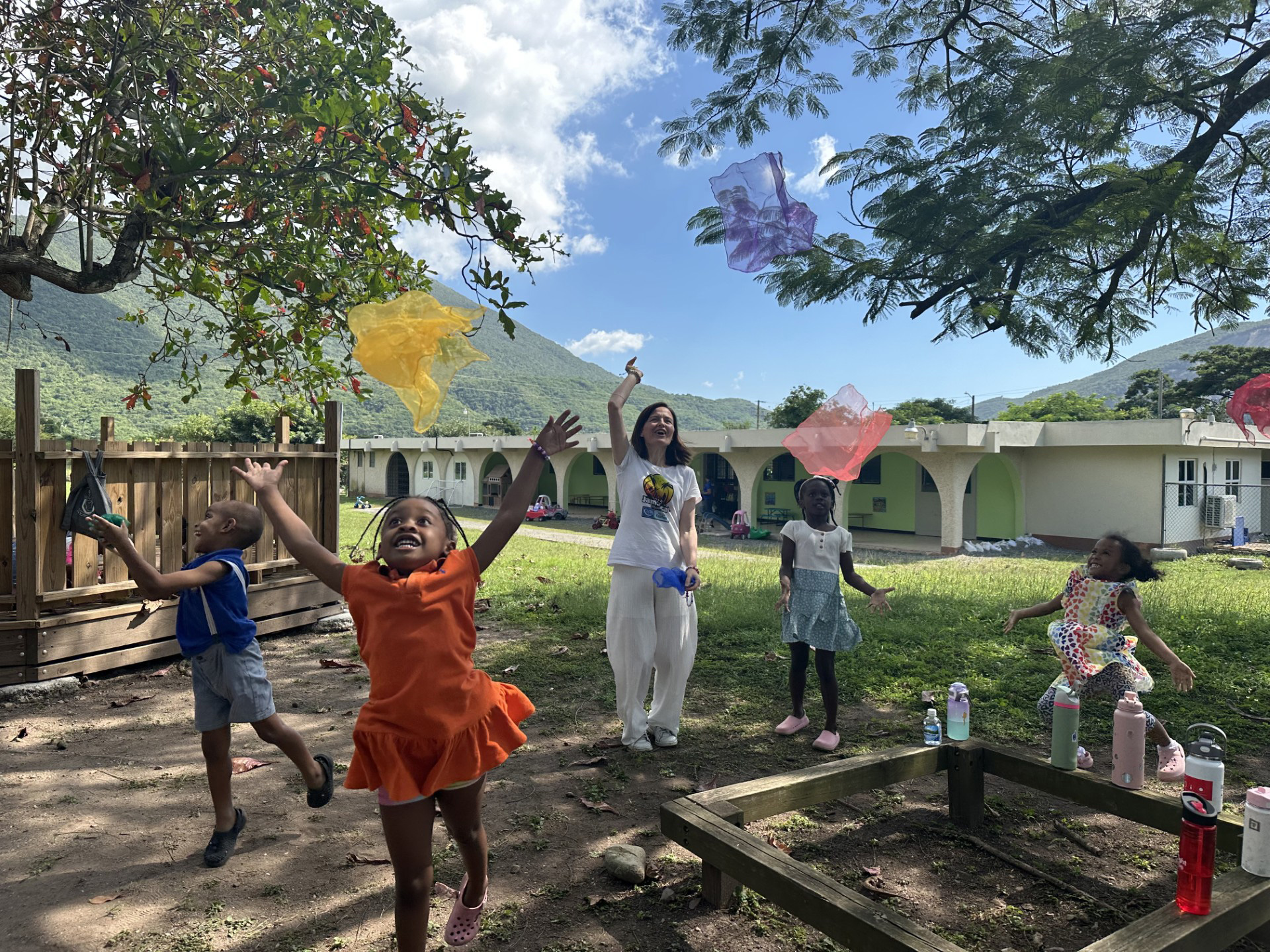 Sonila Maka playing with children in Jamaica