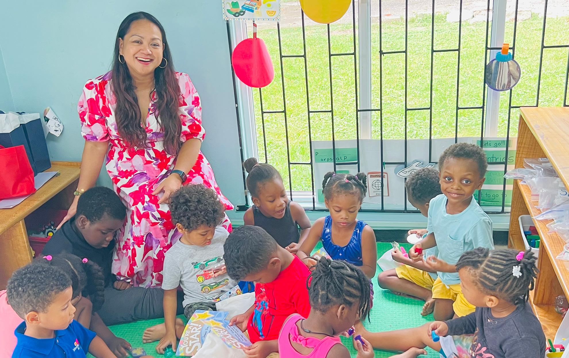 Jamaica Proect 2025 student working with young children at Bloom Child Development Center in Jamaica