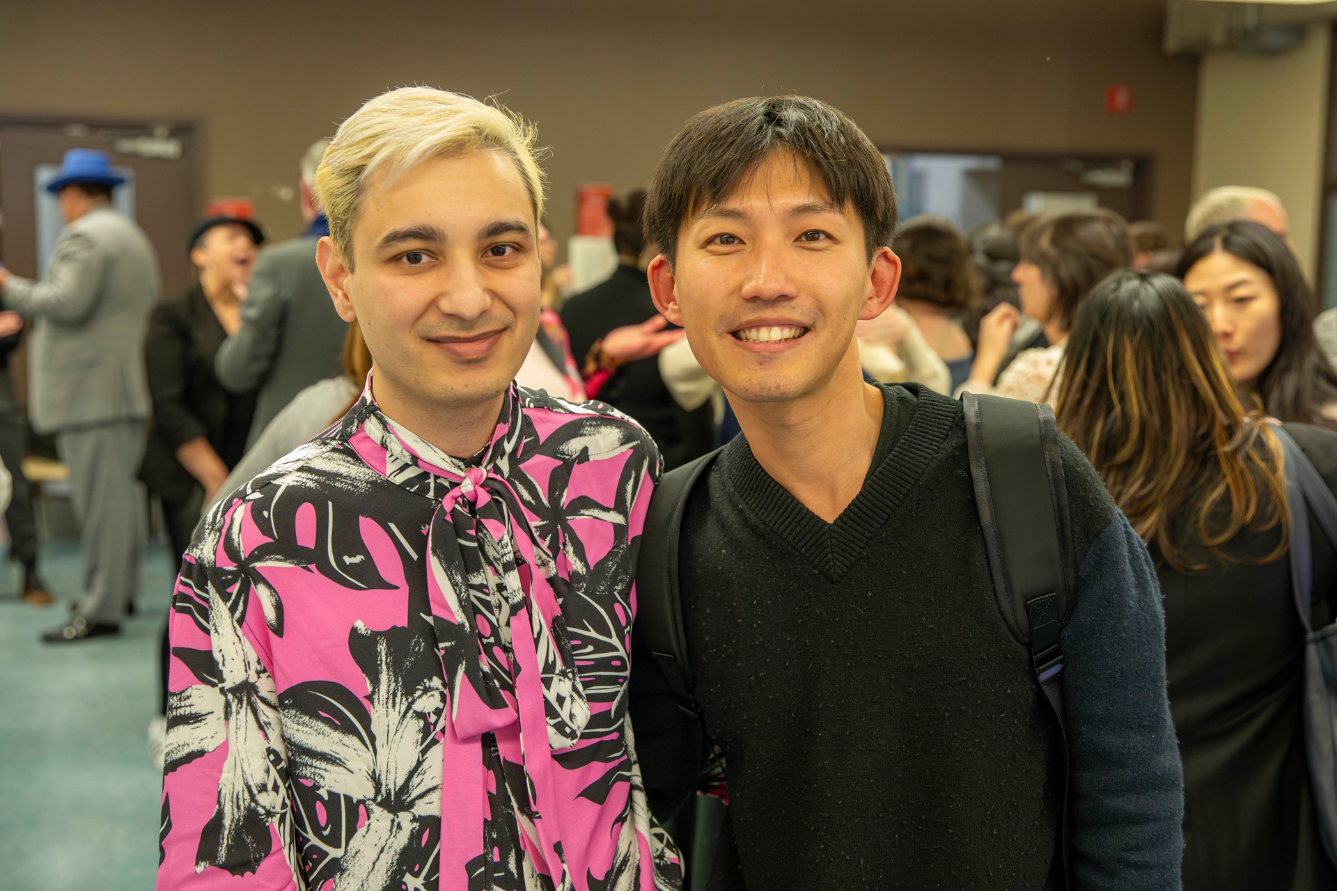 Two men stand side by side at the alumni chapter launch.