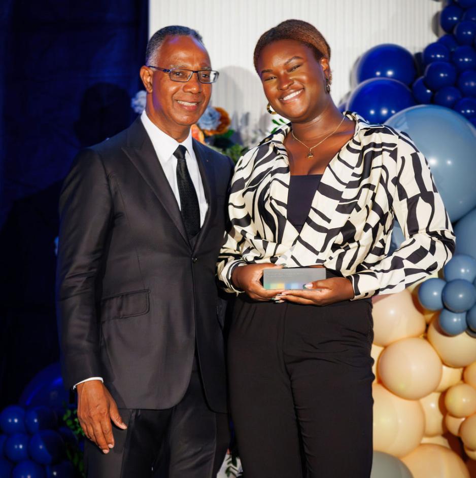 GBC President Dr. Gervan Fearon standing with 2023 President's Award winner Abisola Asha