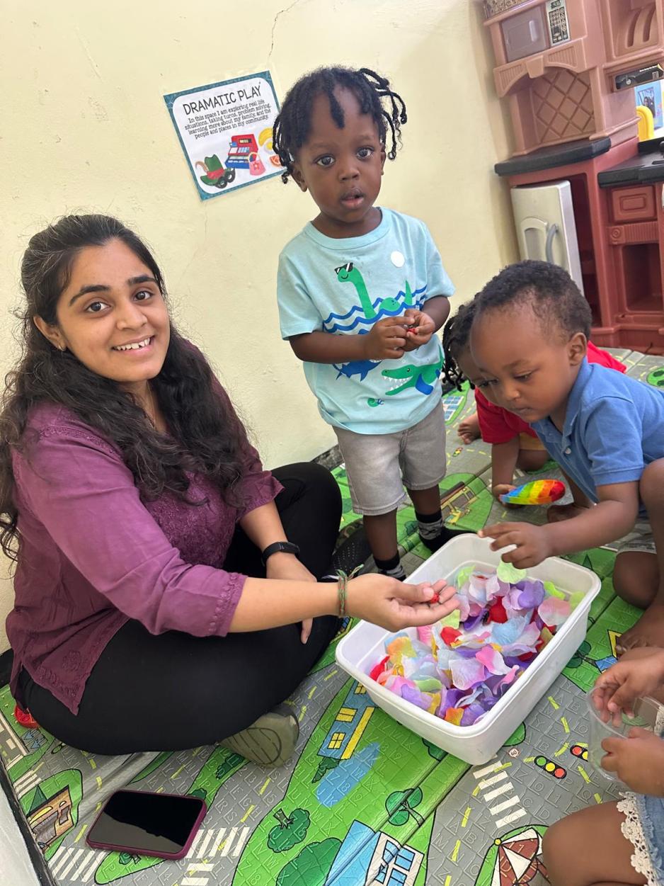 Project Jamaica 2025 student Saniya, with children at Bloom Early Learning Centre, Kingston, Jamaica