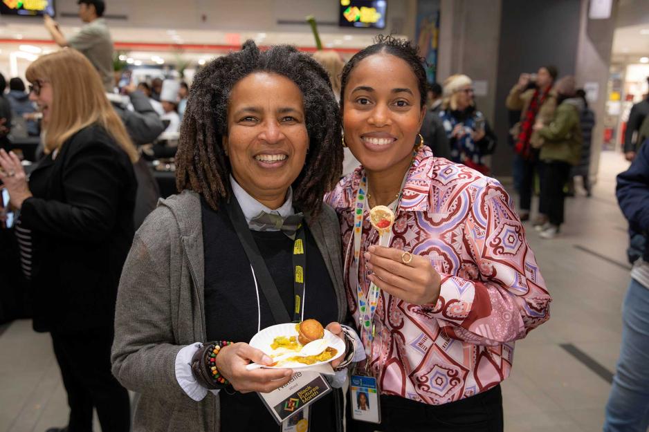 2 people celebrating at the Roots and Recipes event on February 5, 2025