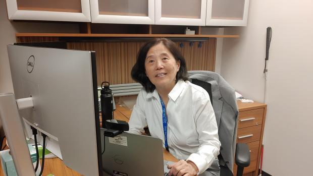 Yin Brown in her office smiling at the viewer