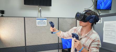 A student using the virtual reality equipment in the Casa Loma Virtual Reality Lab.